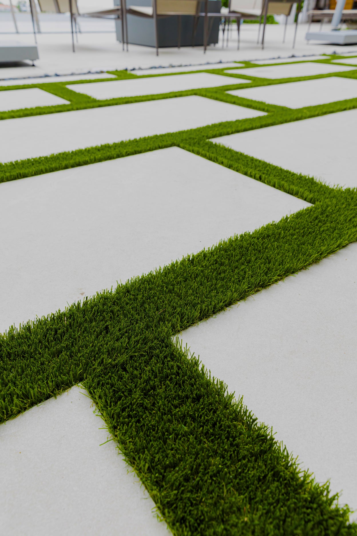 Geometric pattern of grass and concrete in an outdoor setting